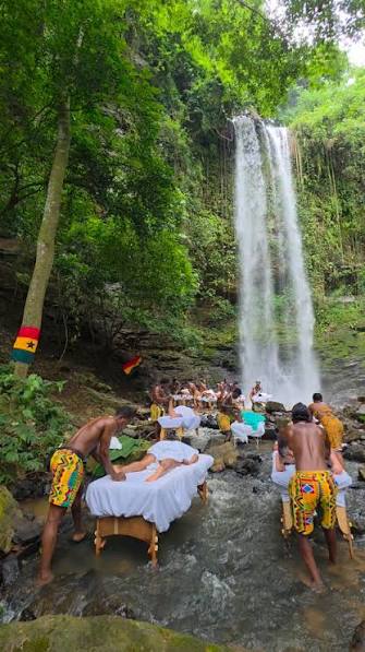 An outdoor wellness spa experience at Asenema Waterfalls in Ghana.