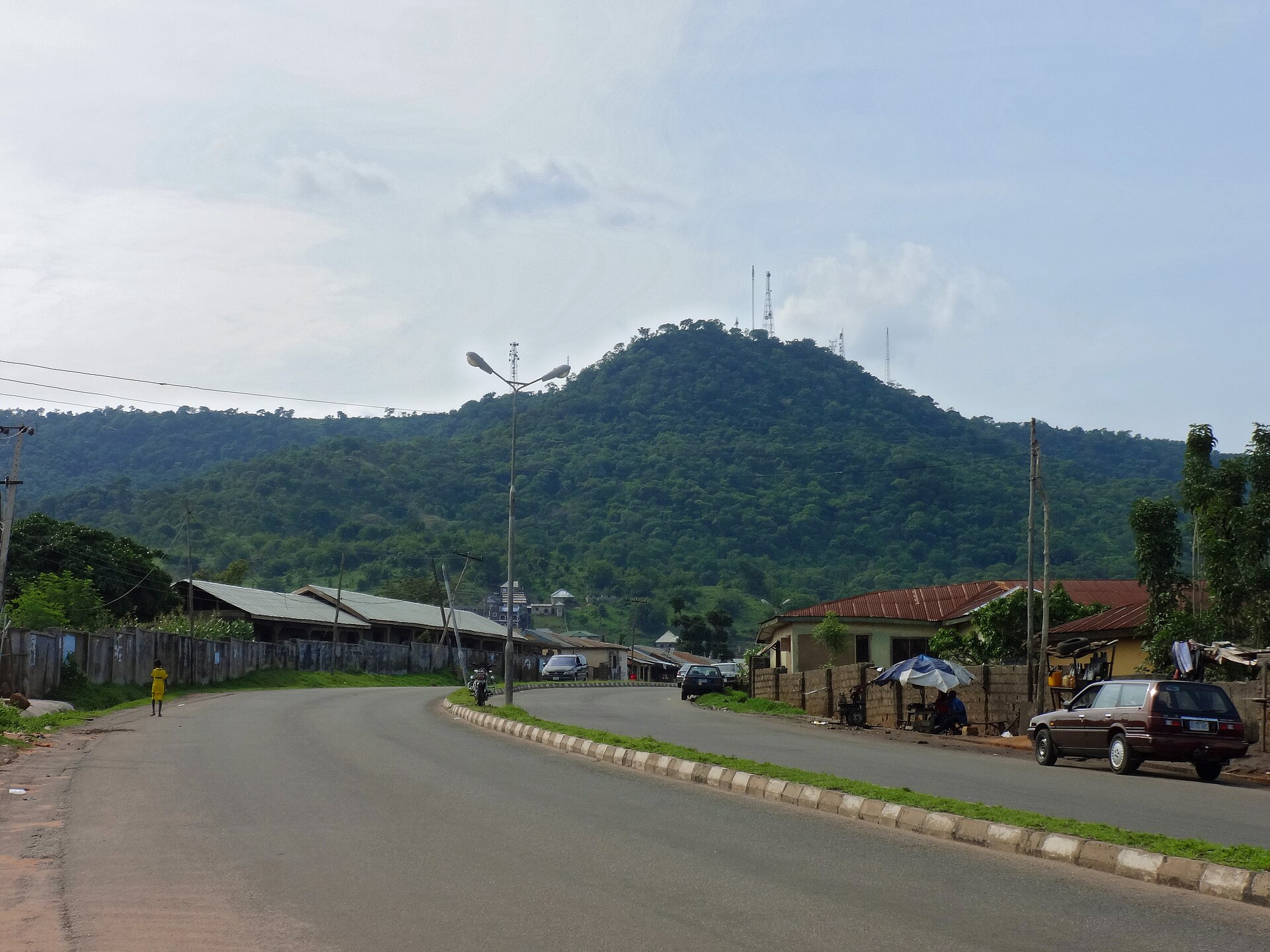 Mount Patti rising above the road on the edge of Lokoja, Kogi State